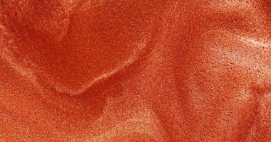 A close up of a red fabric video