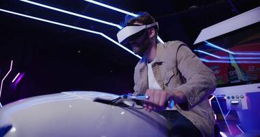 A man wearing a virtual reality headset on a white bike video