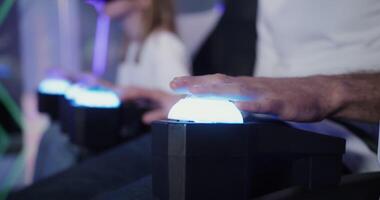 A person is holding a controller with a light on it video