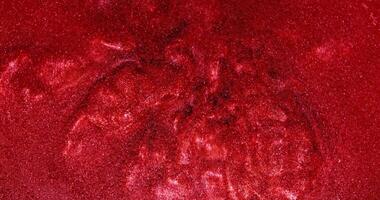 A red liquid is seen on the surface of a surface video