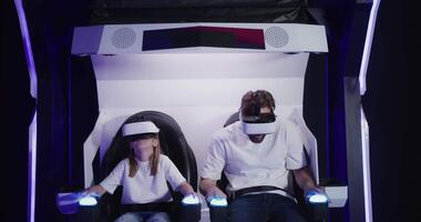 A man and a child in a virtual reality chair video