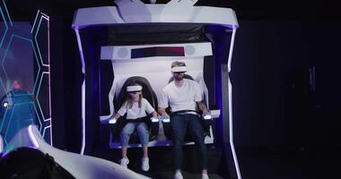 A man and woman in a virtual reality experience video