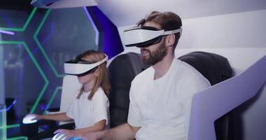 A man and a woman wearing virtual reality headsets video