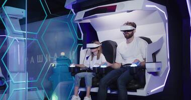 A man and woman in virtual reality headsets video