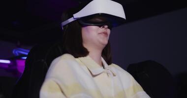 A woman wearing a virtual reality headset video
