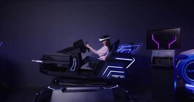 A woman in a virtual reality headset is sitting in a chair video