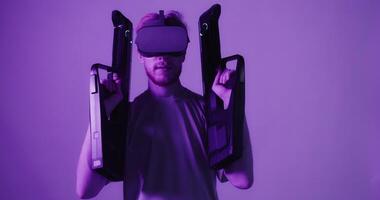 A man wearing a vr headset and holding a pair of headphones video