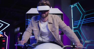 A man wearing a virtual reality headset on a motorcycle video