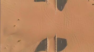A view of the desert from above with two cars video