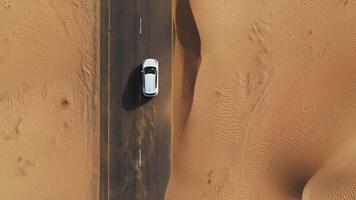 A car driving through the desert in the middle of the desert video
