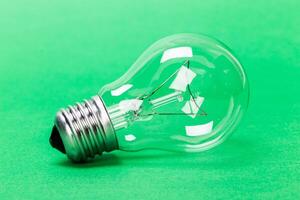 light bulb on green background close up photo