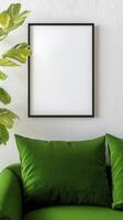 Green sofa with pillows and a framed picture on the wall photo