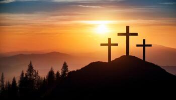 Three crosses stand on hill. Sunrise over the mountains. Religious symbol. Christian concept. Good friday. Easter sunday. Light in the sky. photo