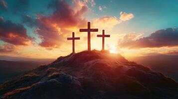 Three Crosses on Hill. Calvary at Sunset. Christian Easter Religious Scene. Sunlight shines on the horizon. Silhouette image of faith and hope. photo