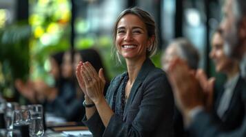 Happy business woman. Group of people clapping. Success in corporate meeting. Teamwork and smiling. Business concept with good results. photo