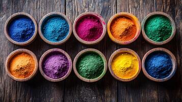 Top view of vibrant Holi powders arranged in decorative photo