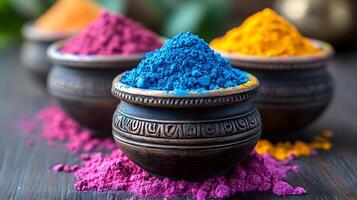 Artistic photo of vibrant Holi powders scattered on a surface with traditional Indian decor in the background
