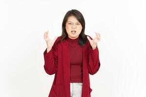 A woman in a red sweater and pants is making an angry face photo