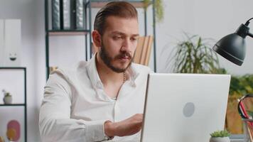 Irritated tired businessman working on laptop website problem, computer virus data loss by hacking video