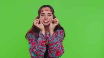 Woman showing a little bit gesture with sceptic smile showing minimum sign measuring small size video