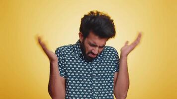 Puzzled clueless uncertain man raising hands in helpless, embarrassed confused by difficult question video