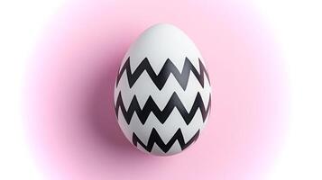 A striking egg with bold black zigzag patterns sits beautifully against a soft pink background, showcasing a blend of simplicity and modern design. photo