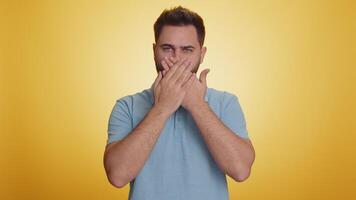 Frightened scared man closing his mouth with hand, gestures no, refusing to tell terrible secret video