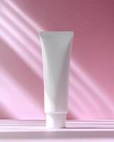 Mockup of cosmetic white tube cream 50ml on stone stand on pink background minimalist. Natural hard lighting and shadows nice photo