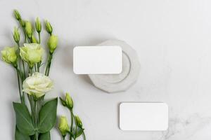 Mockup blank business cards for your design, template on gray marble background with concrete elements photo