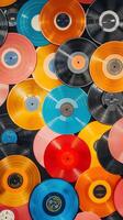 A vibrant stack of vinyl records in colorful patterns photo
