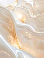 Pearlescent waves, glitters, and golden touch in light textures photo