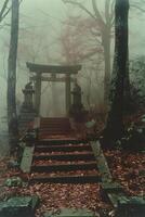 A torii gate in misty forest with stairs and trees photo