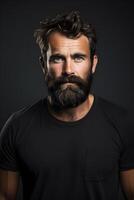Man with beard and mustache in black tshirt, dark background photo