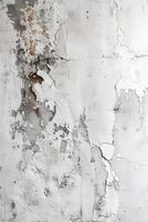 A close up of a grey wall with peeling paint creating a unique pattern photo