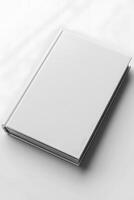 A white netbook rests on a white personal computer photo