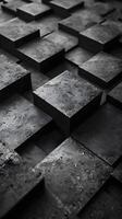 Monochrome image of a pile of rectangular grey bricks in a patterned formation photo