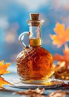 Elegant Glass Bottle of Maple Syrup with Autumn Leaves photo