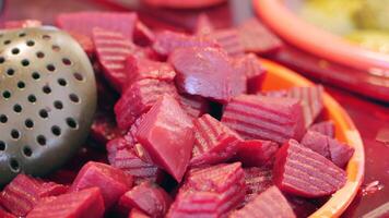 Vibrant display of fresh beets in local market video