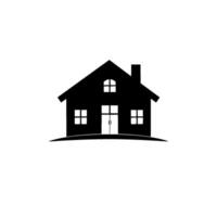 Minimalist black silhouette of a house with a chimney, doors and windows, sitting on a small hill, against a white background. vector