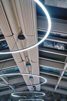 Building ceiling with large round LED lamps photo
