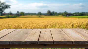 Empty table for product display montages with golden wheat field background photo