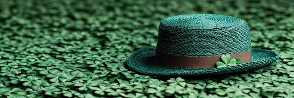 Banner St. Patrick's Day background with green hat and clover leaves with copy space for text photo