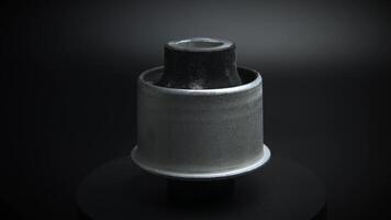Automobile bushings silent blocks on a black background. Rotating spare part. Demonstration of suspension elements video