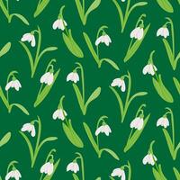 Seamless floral pattern with white snowdrop flowers with green leaves on a dark green background in a minimalistic and elegant design vector