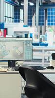 Vertical Photovoltaics factory production manager looking over schematics, instructing worker on adjustments to make. Solar panels plant engineer looking over assembly lines blueprints, talking with employee video