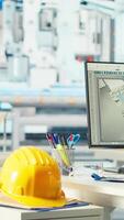 Vertical PC display used to adjust empty photovoltaics facility system parameters, increasing performance. Computer desk in solar cells manufacturing plant optimizing energy supply, close up video