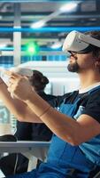 Vertical Solar panels plant specialist using VR headset to develop new technologies harnessing sun power. Photovoltaics factory researcher using virtual reality tech to improve efficiency, camera A video