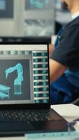 Vertical Solar panels manufacturing plant technician uses CAD program to optimize layouts. Photovoltaics factory staff member doing arrangements for maximum renewable energy output, camera B video