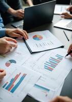 Business people working on papers with graphs and graphs photo