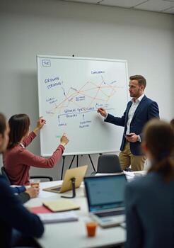 A man is giving a presentation to a group of people photo